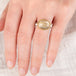 Ring with rutilated quartz stone with an 18k gold bezel and sterling silver band