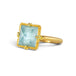 A square-cut light blue aquamarine ring set in an 18k gold bezel, shown on a plain white background.
