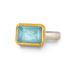 Handmade ring featuring an aquamarine gemstone set in an 18k gold bezel and paired with a sterling silver band, against a white background.
