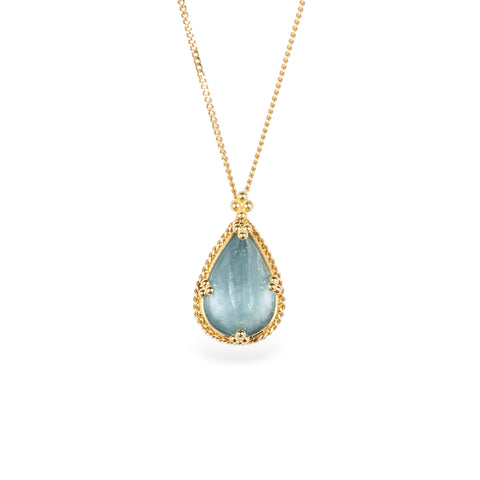 Gold necklace with a teardrop-shaped aquamarine pendant on a white background