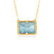 Gold necklace with an aquamarine gemstone and gold chain on a white background