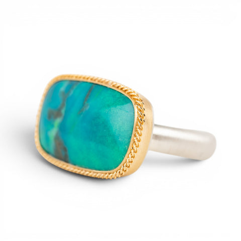 Gold and silver ring with gem silica gemstone on white background