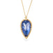 Handmade gold necklace with a blue tanzanite teardrop pendant on a white background