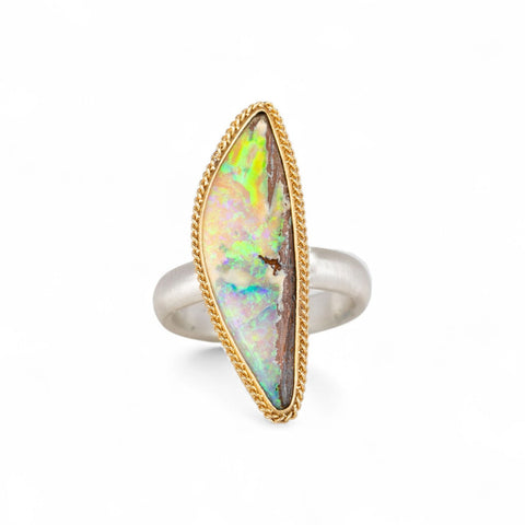 Handmade boulder opal ring with 18k gold bezel and sterling silver band