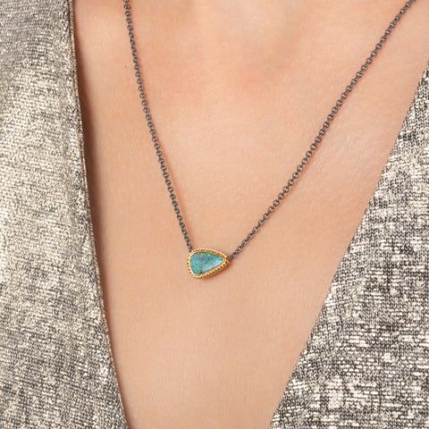 Boulder opal necklace with an 18k gold bezel and oxidized silver chain.