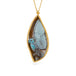 Carved phoenix boulder opal necklace in a gold setting