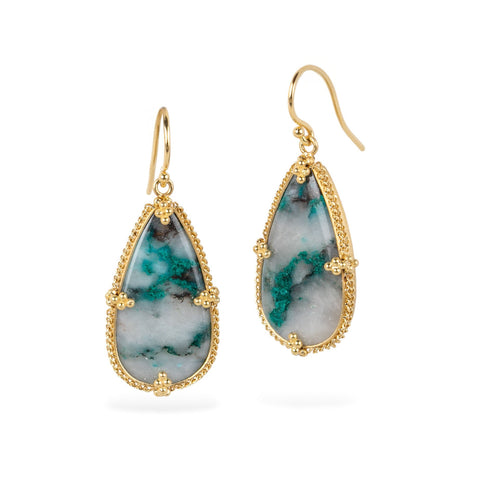 Teardrop-shaped earrings with gold frames and chrysocolla stones on a white background