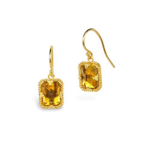 A pair of gold drop earrings featuring rectangular citrine gemstones in a textured bezel setting, shown on a plain white background.