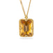 Gold necklace featuring a rectangular citrine gemstone, shown against a white background.
