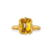 Gold ring featuring a citrine stone set in an 18k gold bezel, shown against a white background.