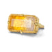 A gold ring featuring a large, rectangular, Citrine gemstone set in a detailed gold bezel, seen against a white background.