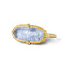 An oval ring featuring a textured light blue dumortierite stone in a yellow gold bezel setting and a matching gold band, shown on a white background.