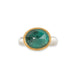 An oval emerald gemstone ring set in a gold bezel, with a sterling silver band, shown against a plain white background.
