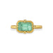 A gold ring featuring a light green emerald gemstone, against a white background.