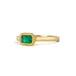 A yellow gold ring featuring a rectangular emerald gemstone in an 18k gold bezel setting, shown on a clean white background.