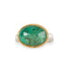 A gold and silver ring featuring an emerald stone, shown against a white background.