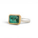 A rectangular emerald stone ring with a gold bezel and a sterling silver band, shown on a plain white background.