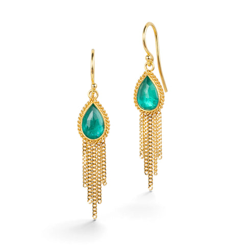 Gold earrings featuring emerald gemstones and gold chain tassels, shown against a white background.