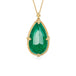Emerald teardrop pendant with handcrafted gold setting on a white background