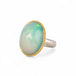 Ethiopian opal ring with a gold bezel and sterling silver band