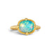 Gold ring featuring a vibrant Ethiopian opal stone, set against a white background.