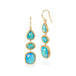Gold earrings with turquoise gemstones on a white background