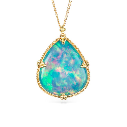 Ethiopian opal pendant necklace with gold setting on a white background