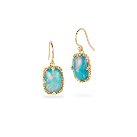 Ethiopian opal earrings with gold bezels on a white background