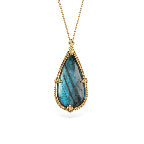 Gold necklace featuring a teardrop-shaped labradorite pendant on a gold chain against a white background.