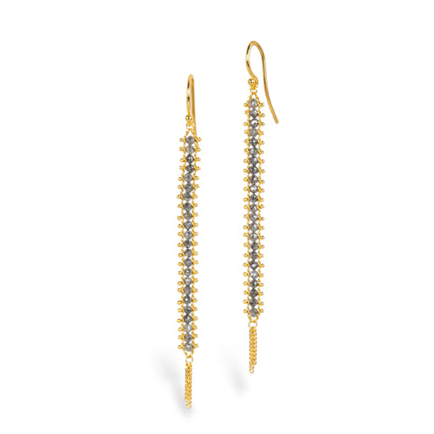 Gold earrings featuring rows of grey diamonds, against a white background.