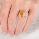 Hand wearing a mexican opal ring set with a handcrafted 18k gold bezel and sterling silver band