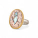 Handcrafted ring with a mexican opal stone, gold setting and sterling silver band on a white background