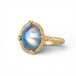 Gold ring with a moonstone on a white background