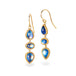 Gold earrings with moonstone stones on a white background