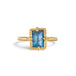A gold ring featuring a rectangular moonstone set in a 18k gold bezel, against a clean white background.
