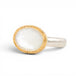 Gold and silver ring with a mother of pearl on a white background