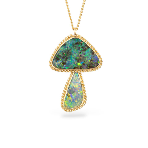 Boulder opal mushroom necklace with gold frame on a white background