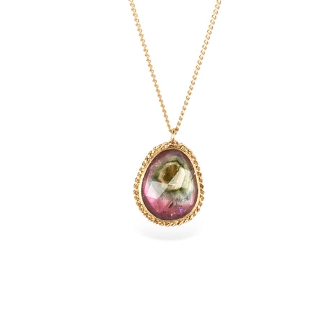 Handmade necklace featuring a watermelon tourmaline gemstone set in a 18k gold bezel and strung on a matching gold chain