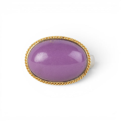A gold and silver ring featuring a phosphosiderite stone, shown against a white background.