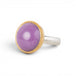 A gold and silver ring featuring a phosphosiderite stone, shown against a white background.