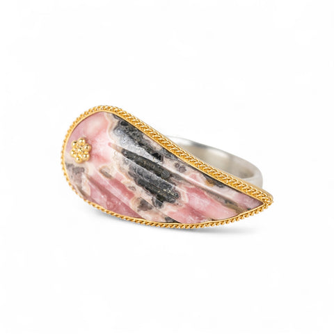 Carved rhodochrosite wing ring with a gold setting and silver band