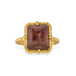 A gold ring featuring an Oregon Sunstone gemstone in a 18k gold bezel setting, shown against a plain white background.