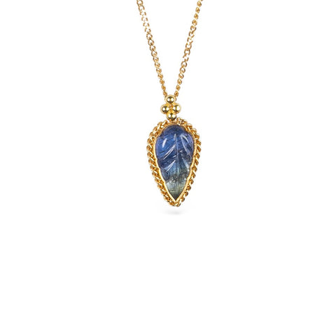 Gold necklace with a leaf-shaped tanzanite on a white background