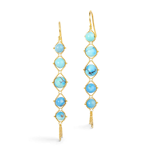Gold earrings featuring golden hills turquoise stones, shown against a white background.