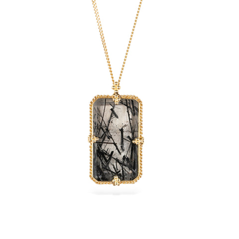 Handmade 18k yellow gold necklace with a tourmalated quartz pendant on a white background