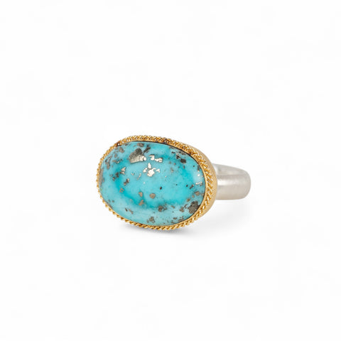 Handmade fine jewelry turquoise ring with an 18k gold bezel and sterling silver band