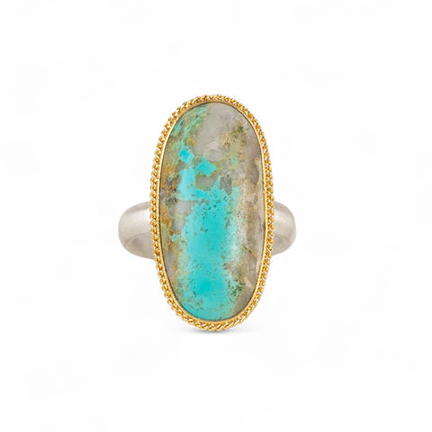 Handmade fine jewelry turquoise ring with an 18k gold bezel and sterling silver band