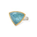 Aquamarine stone ring with gold setting and silver band on a white background