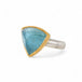 Aquamarine stone ring with gold setting and silver band on a white background