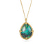 Gold necklace with a black opal teardrop pendant on a white background